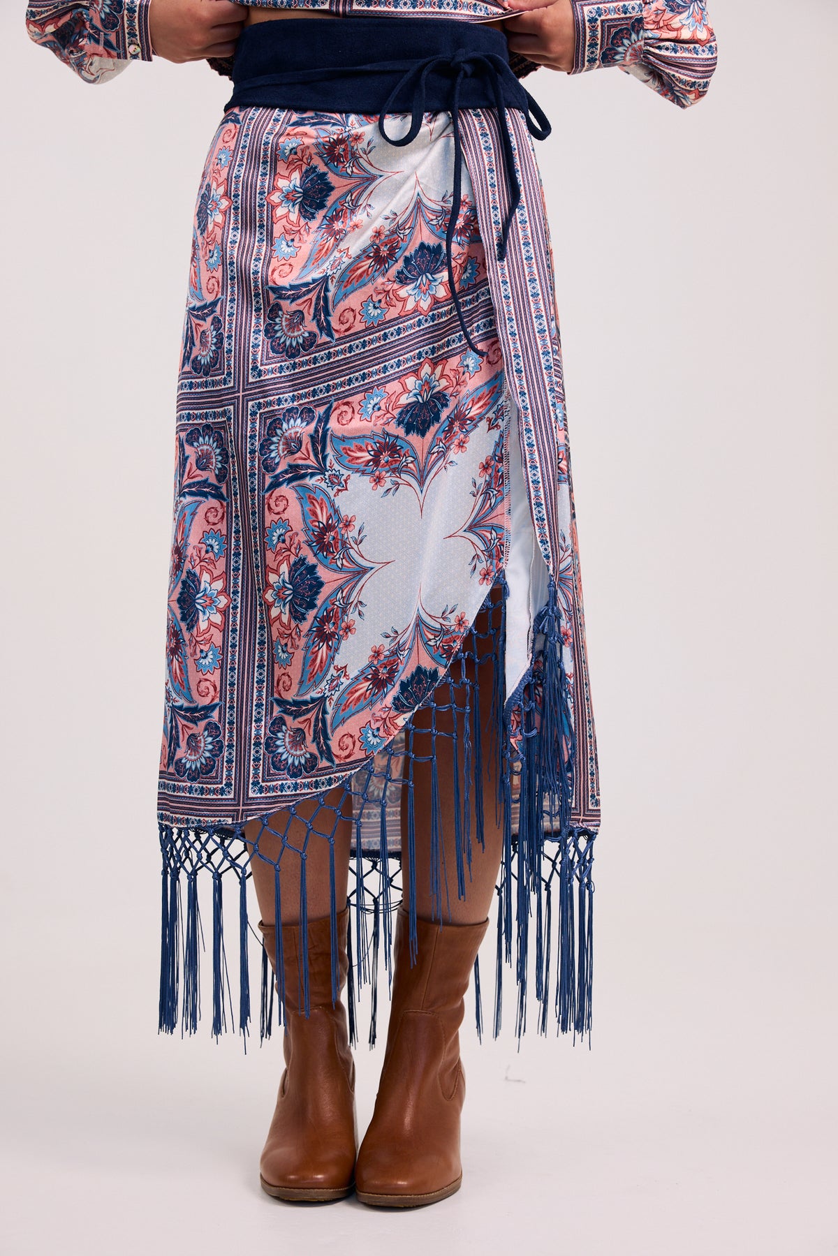 The Aries Draped Fringe Hem Midi Skirt